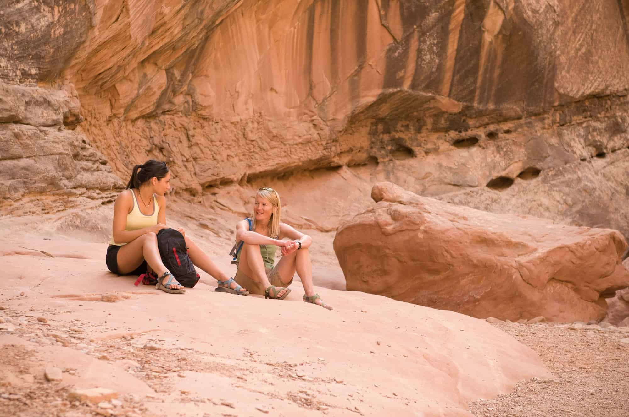 Rock climbers relaxing on boulder